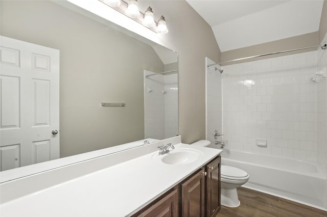 full bath with washtub / shower combination, vanity, toilet, and wood finished floors