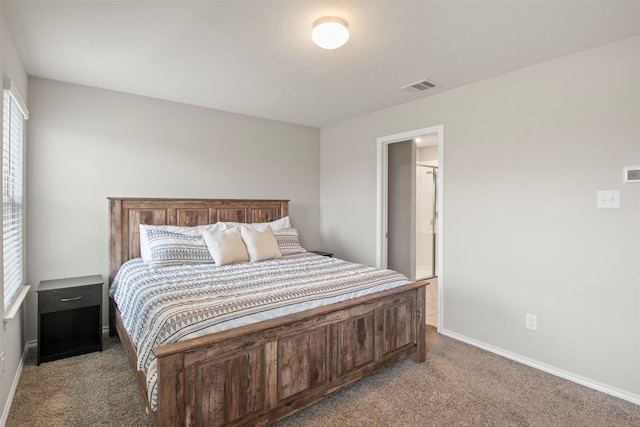 bedroom featuring baseboards, visible vents, and light colored carpet