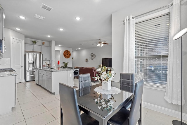 dining room featuring light tile patterned floors, visible vents, and recessed lighting