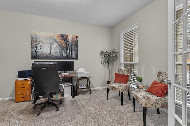 office with carpet floors, baseboards, a wealth of natural light, and french doors