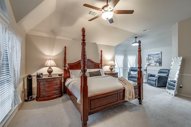 bedroom with visible vents, vaulted ceiling, light carpet, and ceiling fan