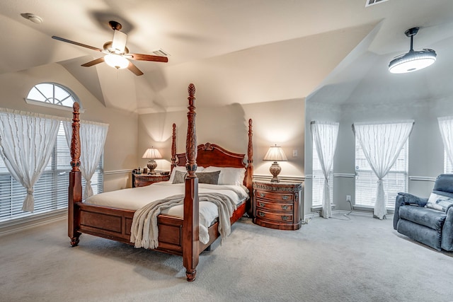 bedroom with high vaulted ceiling, a ceiling fan, and light colored carpet