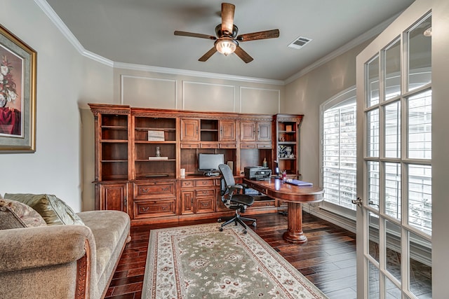 office featuring visible vents, dark wood finished floors, a ceiling fan, and ornamental molding