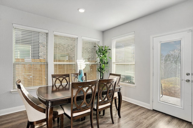 dining room with wood finished floors and baseboards