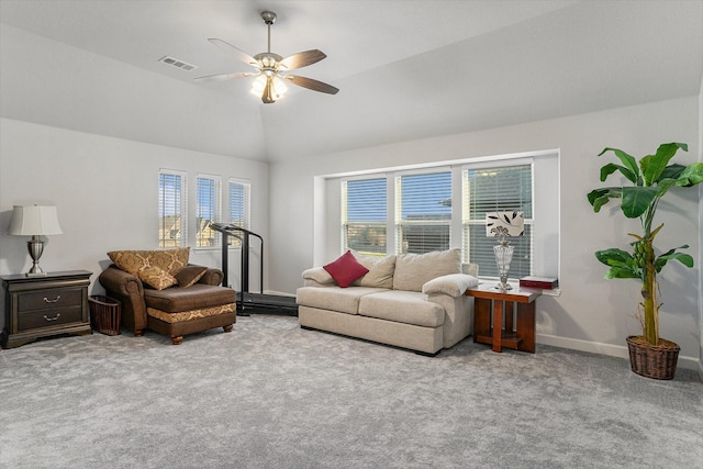 living area featuring ceiling fan, visible vents, baseboards, vaulted ceiling, and carpet