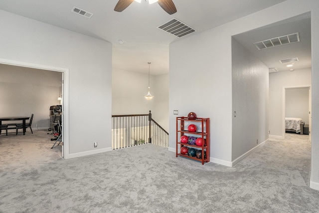 interior space with carpet floors and visible vents