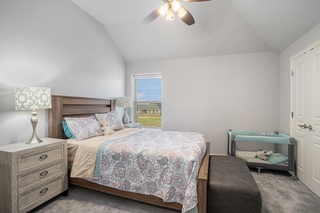 bedroom featuring vaulted ceiling, ceiling fan, and carpet flooring