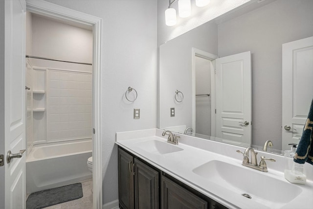 full bath featuring shower / washtub combination, a sink, toilet, and double vanity