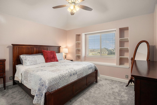 bedroom with light carpet, ceiling fan, and baseboards