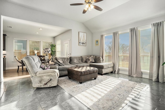 living room with visible vents, baseboards, vaulted ceiling, and a ceiling fan