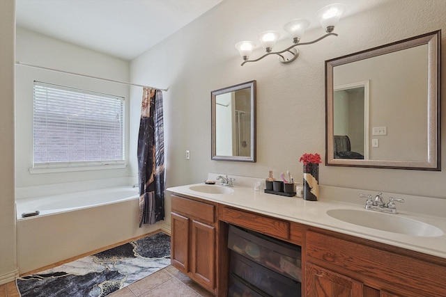 bathroom featuring a bath, tile patterned flooring, double vanity, and a sink