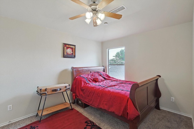 carpeted bedroom with a ceiling fan, visible vents, and baseboards