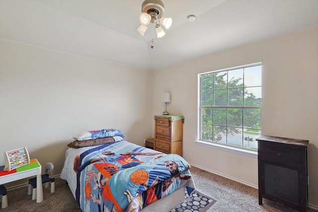 bedroom with carpet and baseboards