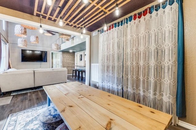 unfurnished dining area with dark wood-style floors