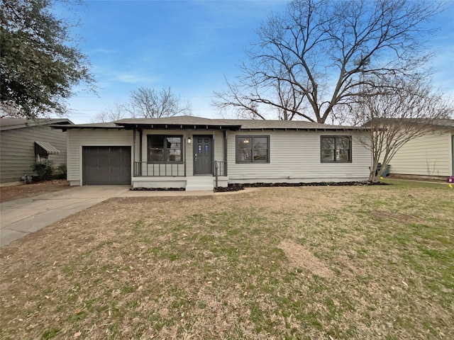 view of front of house with a garage, a front yard, and driveway