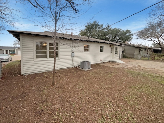 back of property featuring central air condition unit