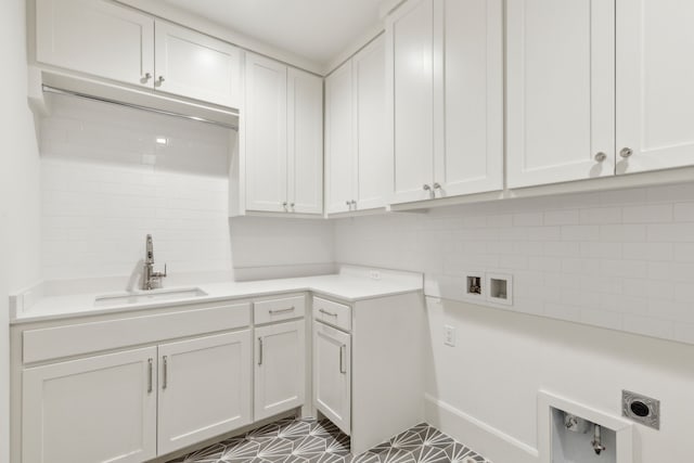 9514 Still Creek Ln, Dallas, TX 75238 - washroom with electric dryer hookup, washer hookup, cabinet space, and tile patterned flooring