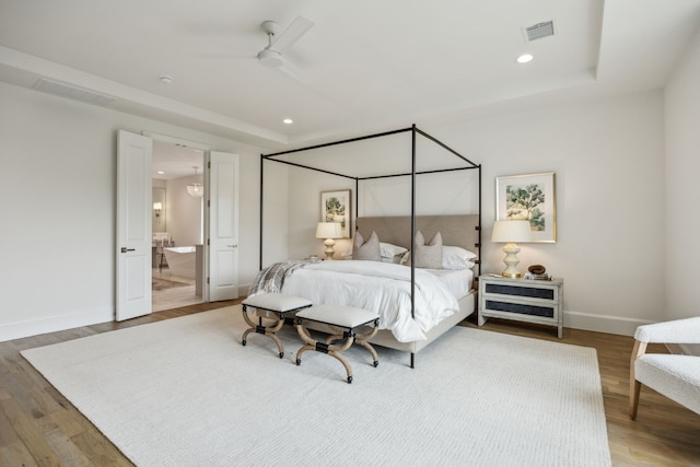 9514 Still Creek Ln, Dallas, TX 75238 - bedroom featuring wood finished floors, recessed lighting, baseboards, and ensuite bathroom