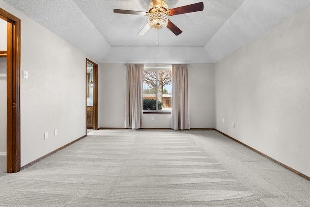 unfurnished room featuring light colored carpet and baseboards