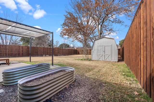 view of yard with a vegetable garden, a storage shed, a pergola, a fenced backyard, and an outdoor structure