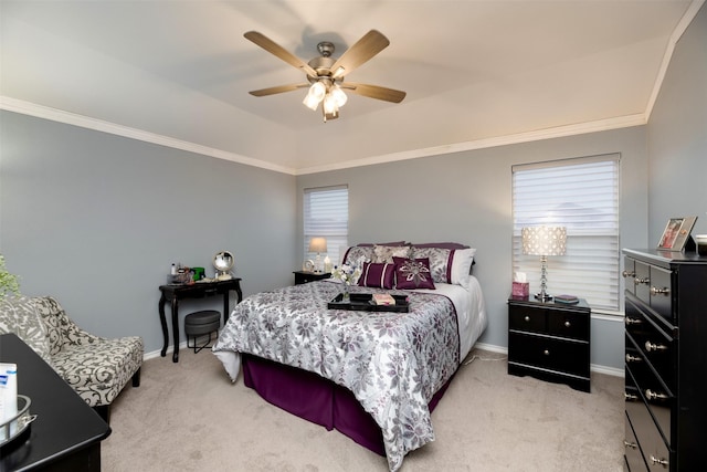 bedroom with crown molding, a raised ceiling, light colored carpet, ceiling fan, and baseboards