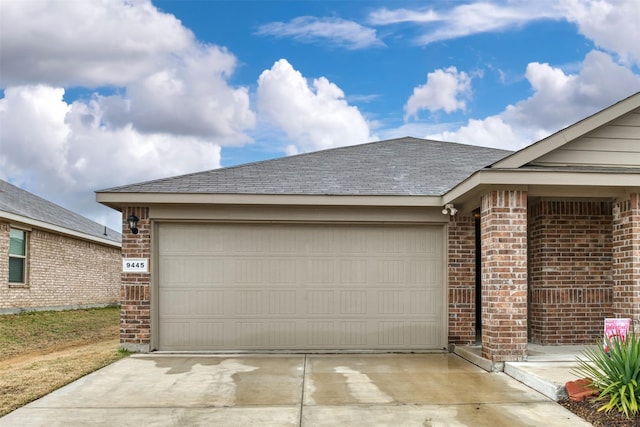 garage featuring driveway