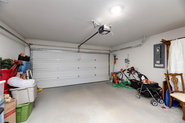 garage with electric panel and a garage door opener