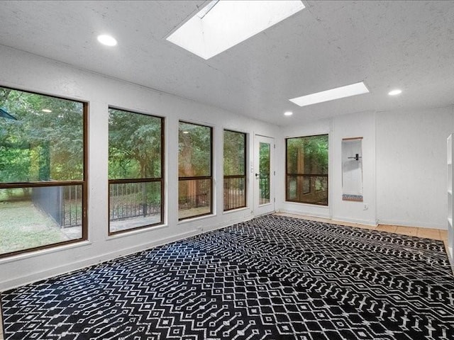 5114 Westhaven Rd, Arlington, TX 76017 - unfurnished sunroom with a skylight, recessed lighting, a textured ceiling, and baseboards