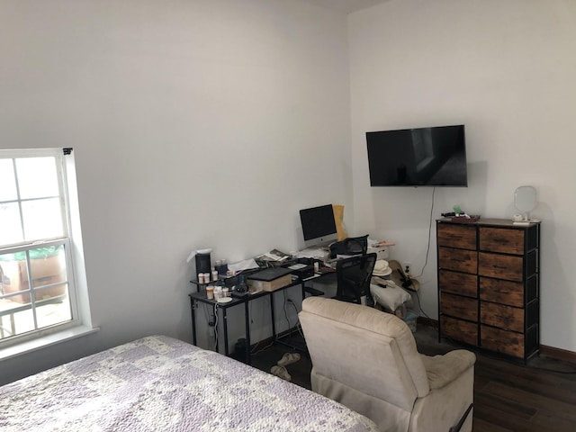 bedroom featuring dark wood-style floors