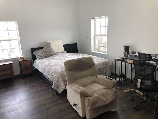 bedroom featuring dark wood-style floors