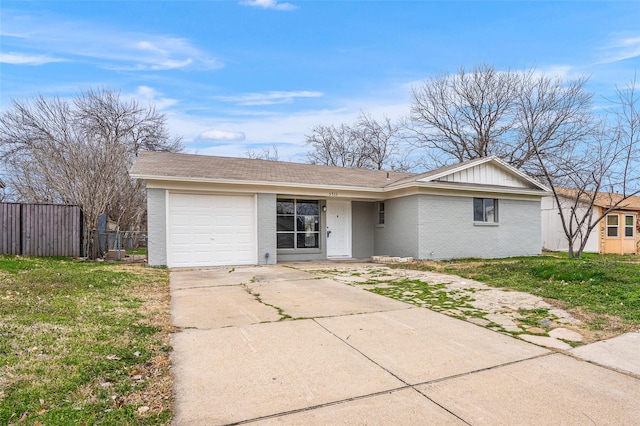 single story home featuring a garage, brick siding, driveway, board and batten siding, and a front yard