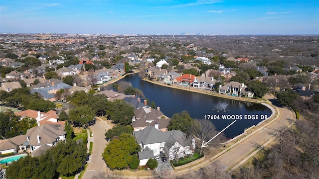 bird's eye view with a water view and a residential view