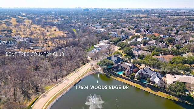 birds eye view of property with a water view and a residential view