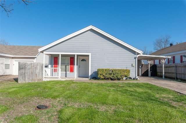 view of front of house with covered porch, a front lawn, and concrete driveway