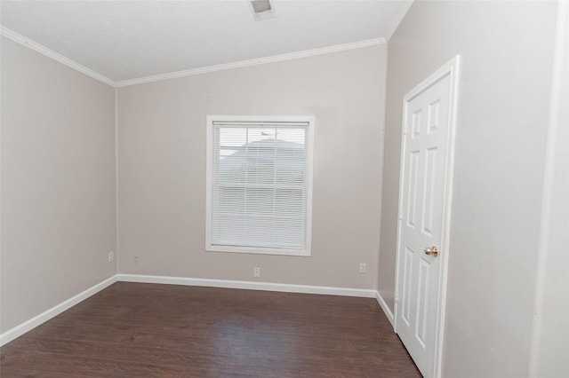 spare room featuring visible vents, baseboards, dark wood-style flooring, a textured ceiling, and crown molding