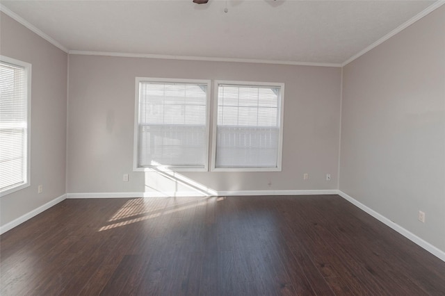 spare room featuring a ceiling fan, baseboards, dark wood-style flooring, and ornamental molding