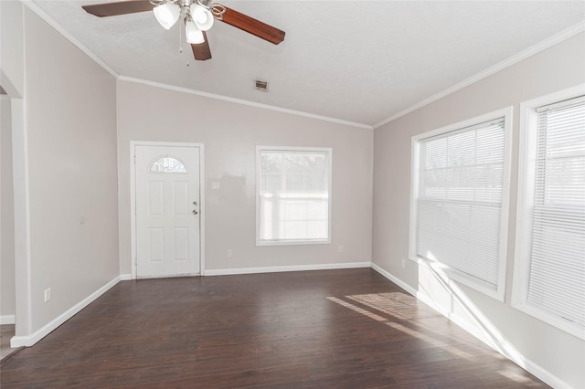 entryway with baseboards, visible vents, dark wood-style floors, ornamental molding, and a textured ceiling