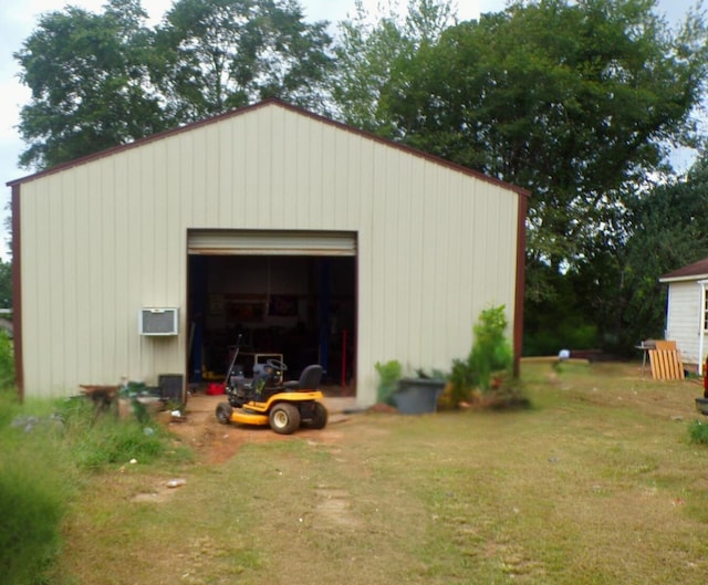 view of outdoor structure featuring driveway and an outdoor structure