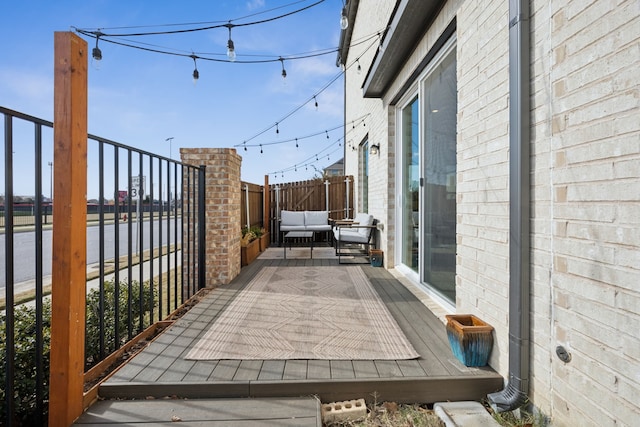 view of patio / terrace with fence and an outdoor hangout area