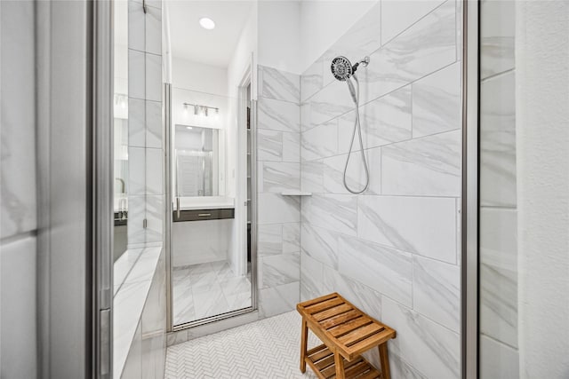 bathroom with recessed lighting and tiled shower