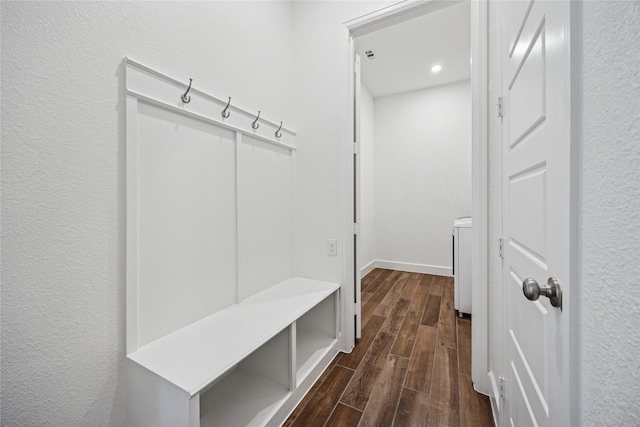 mudroom with wood tiled floor and baseboards