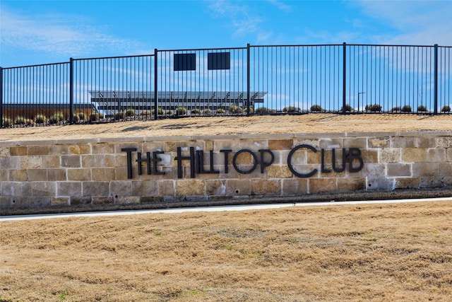 community sign with fence