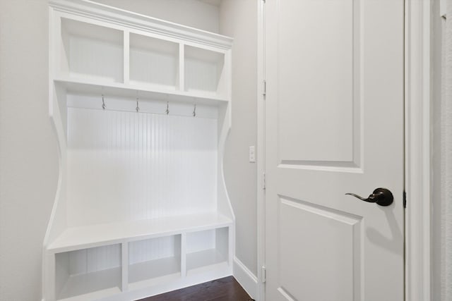 mudroom with dark wood-style flooring