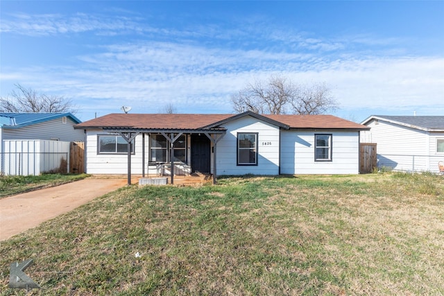 single story home featuring fence and a front lawn