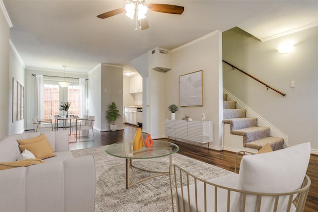 4039 Cole Ave Unit 104, Dallas, TX 75204 - living area with dark wood-style flooring, ornamental molding, a ceiling fan, baseboards, and stairway