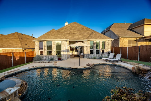 view of pool with a patio area, a fenced backyard, and a fenced in pool