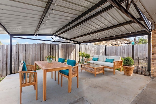 view of patio / terrace featuring an outdoor living space, outdoor dining area, and a fenced backyard