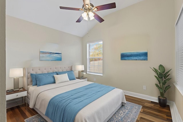 bedroom featuring vaulted ceiling, wood finished floors, baseboards, and ceiling fan