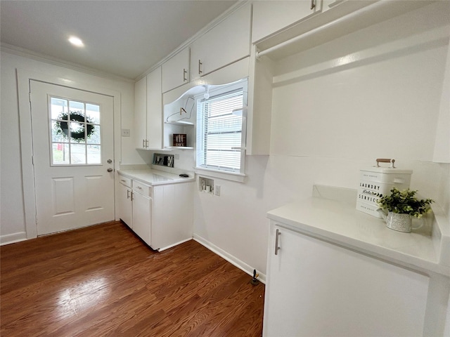 kitchen featuring white cabinetry, light countertops, and dark wood-type flooring