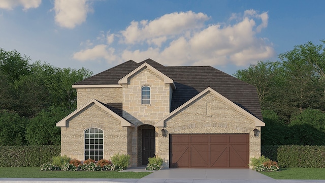 french country home featuring a garage, stone siding, driveway, and brick siding